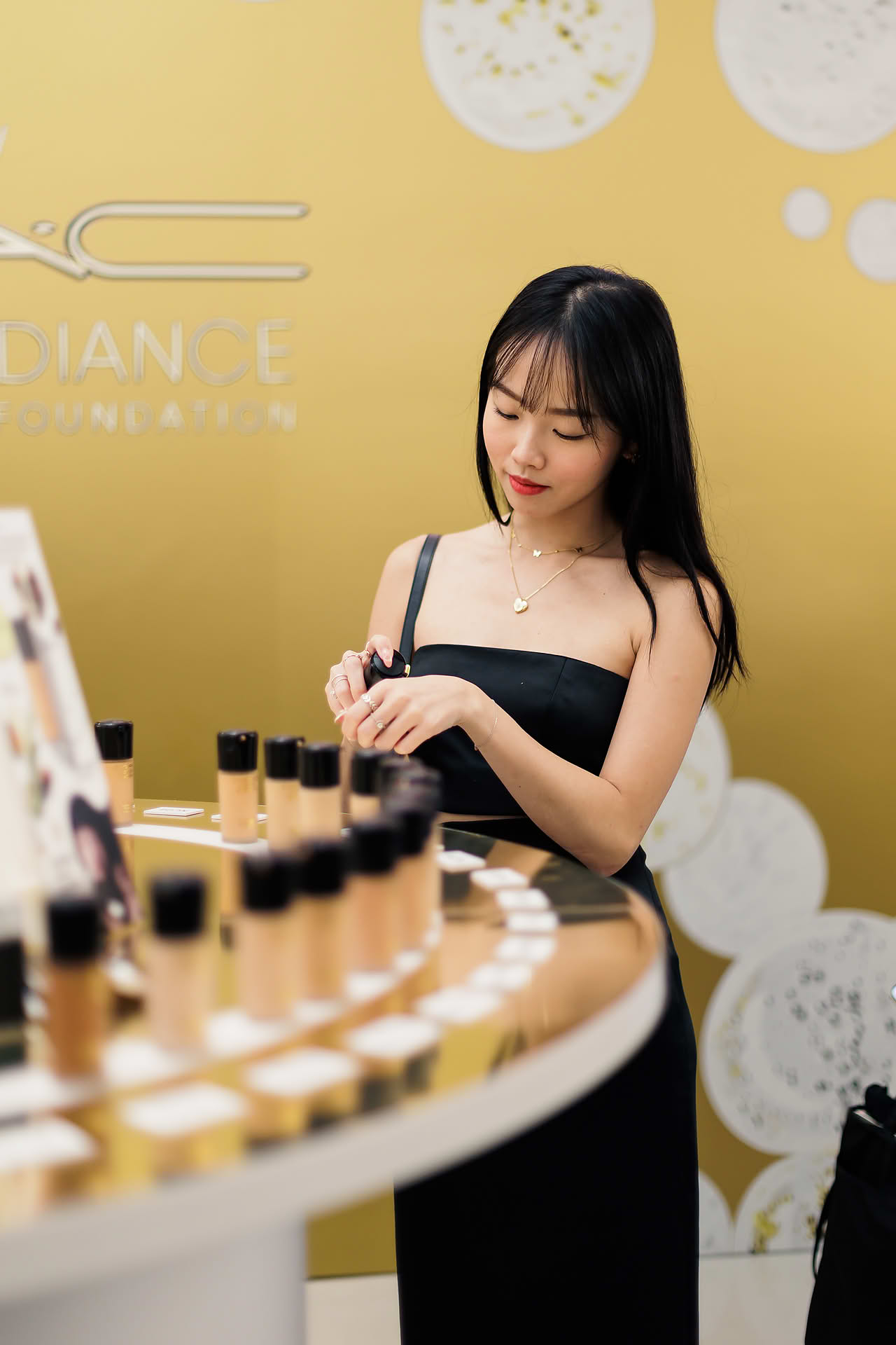 Influencer using product at MAC Cosmestics PR event