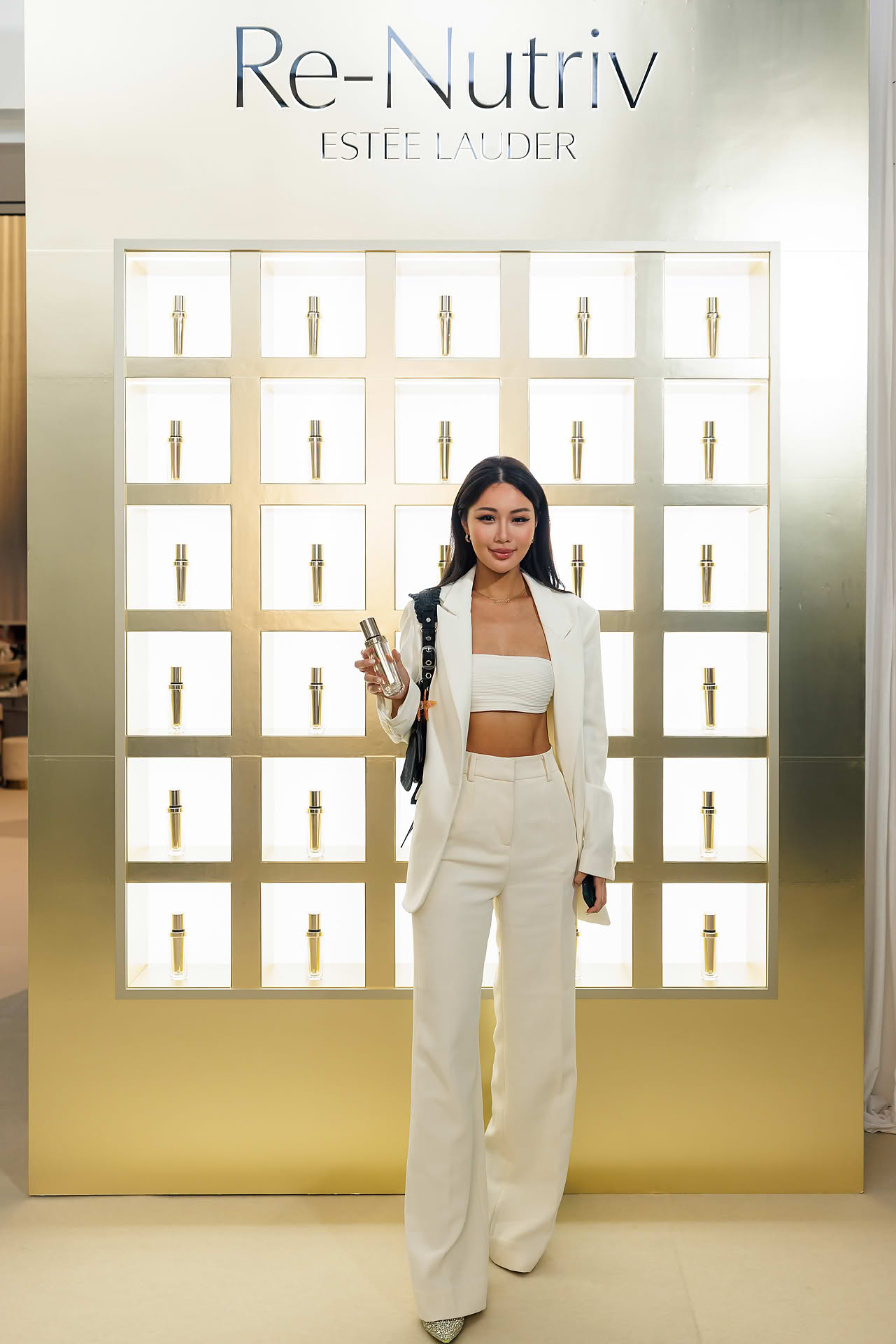 Influencer holding product at Estee Lauder Re-Nutriv PR event
