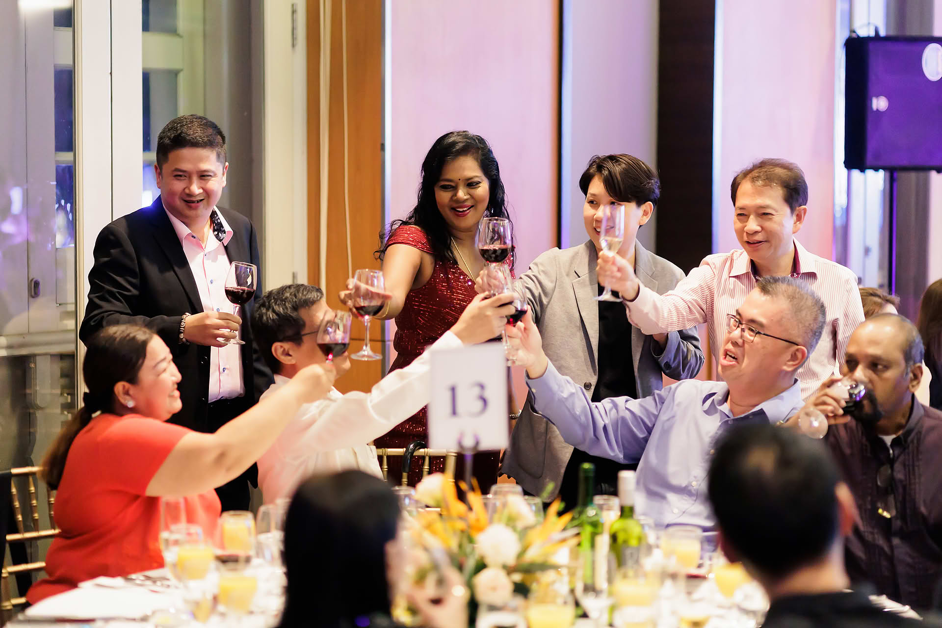 People cheering at SG Land dance and dinner party