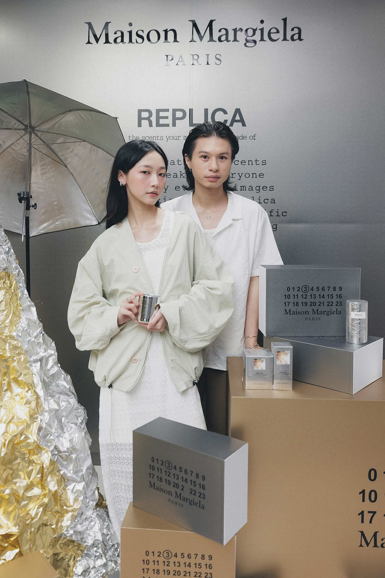 Influencers posing at Maison Margiela pop-up stall in Ngee Ann City