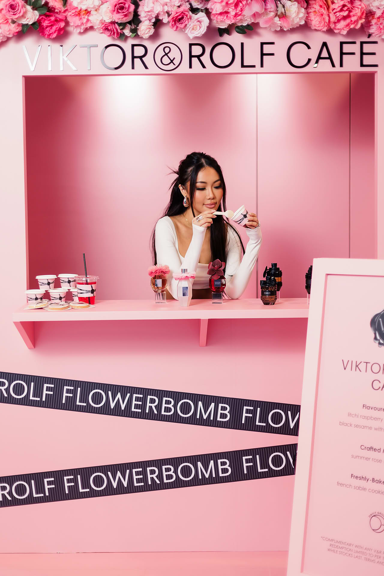 Influencer trying the ice cream at Vicktor Rolf Cafe pop-up stall in Paragon