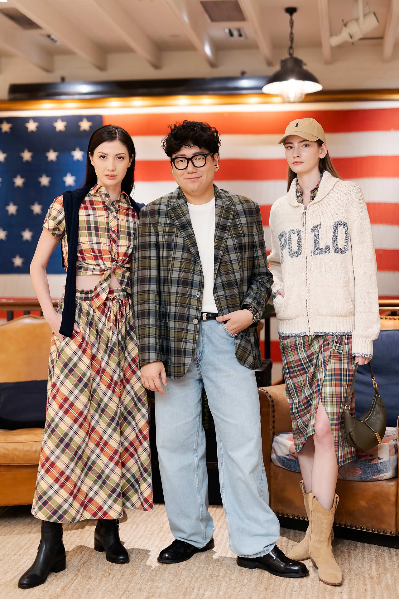 Models posing with designer for Ralph Lauren