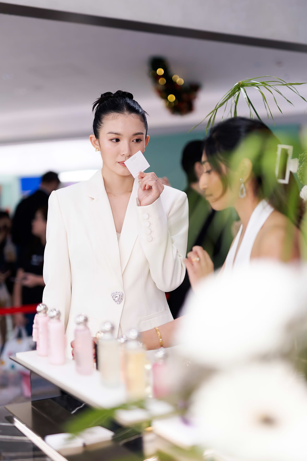 Actress smelling perfume at Parfums de Marly launch event