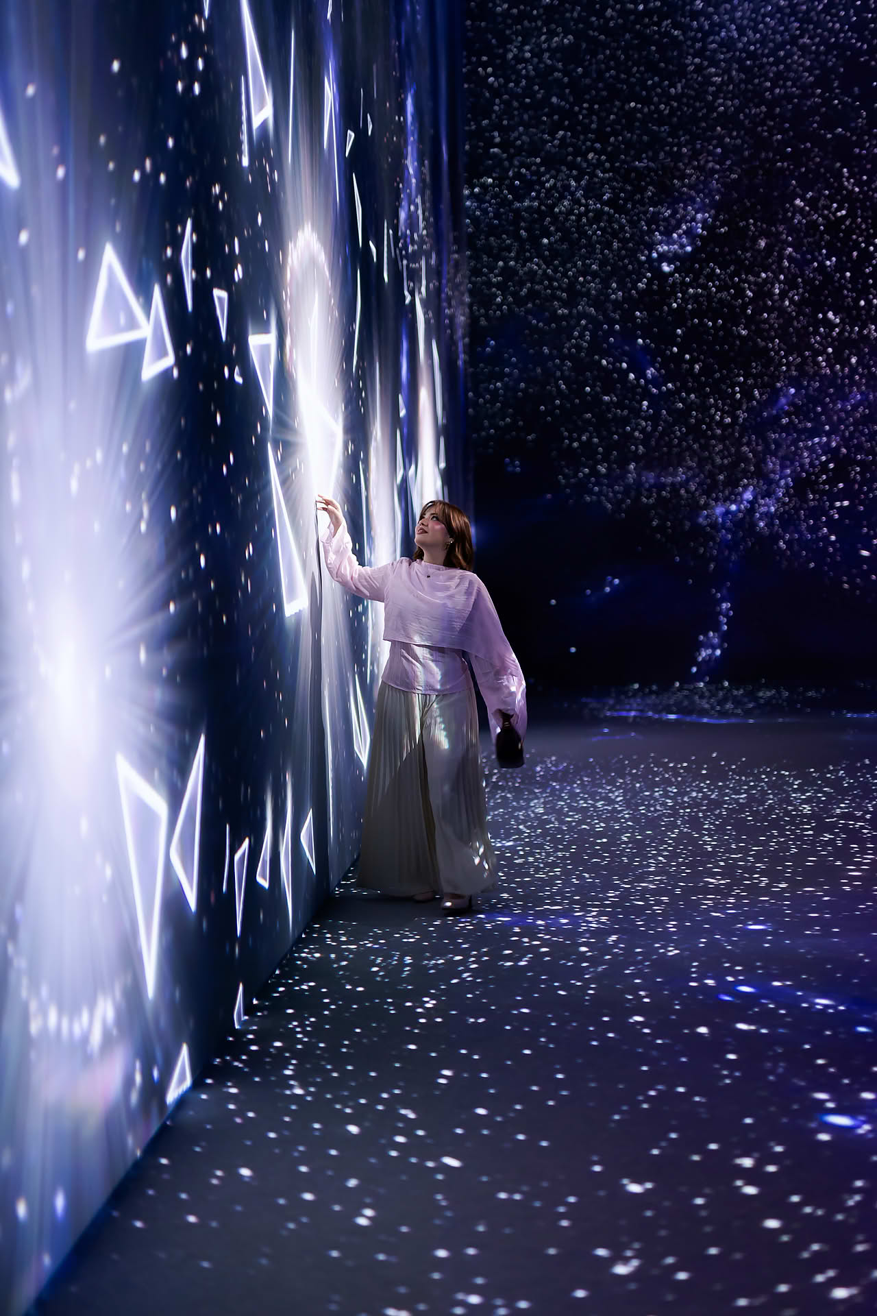 Influencer exploring the place at Issey Miyake interactive venue