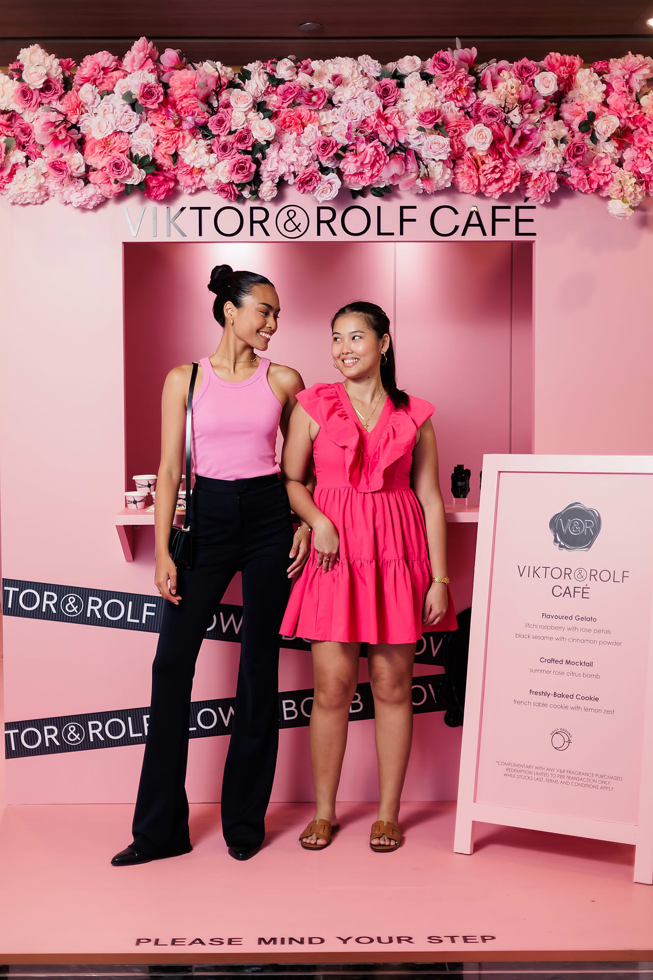 Influencers posing at Vicktor Rolf Cafe pop-up stall in Paragon
