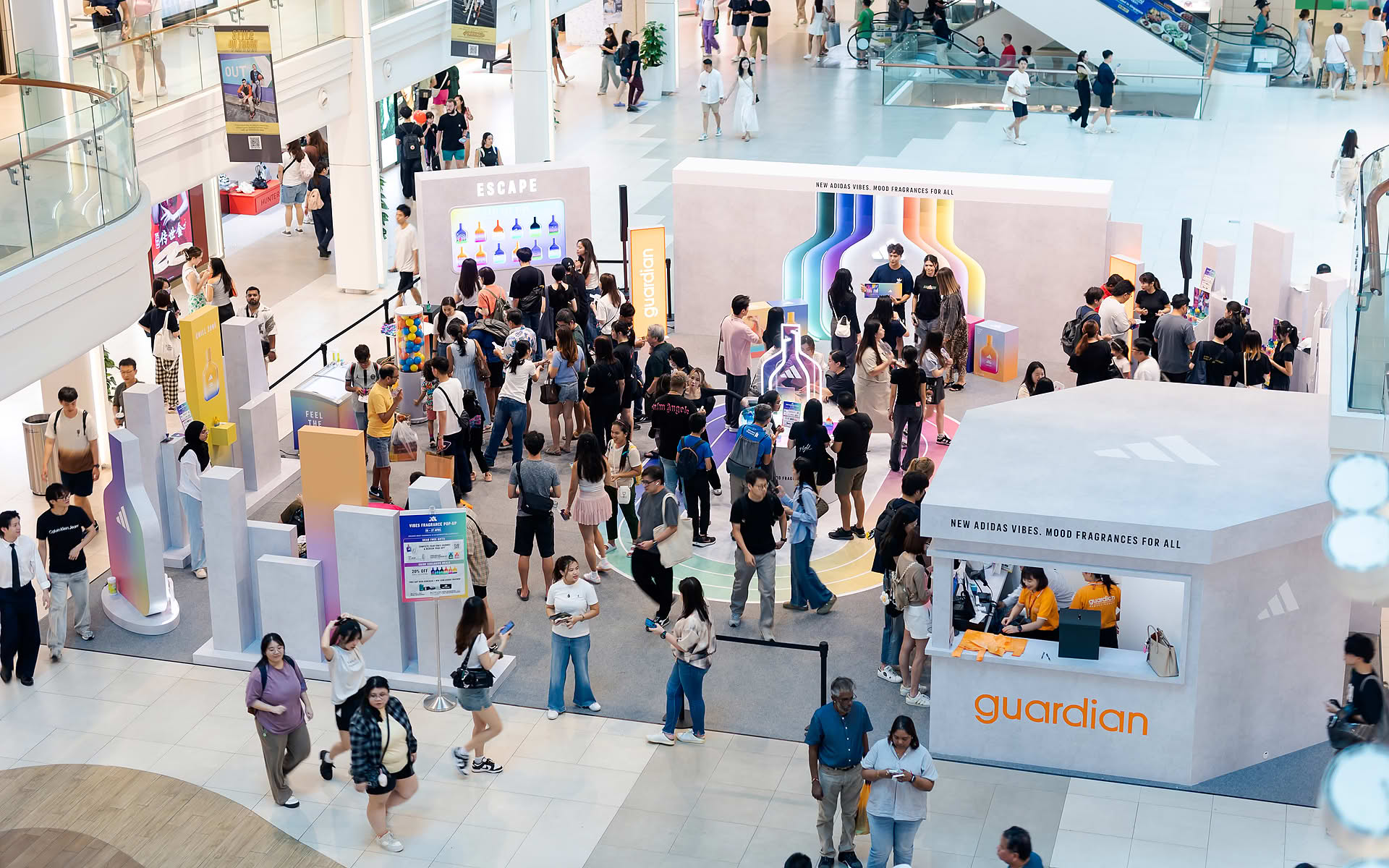 Large crowd gathering at Addidas Vibe pop-up stall in Plaza Singapura