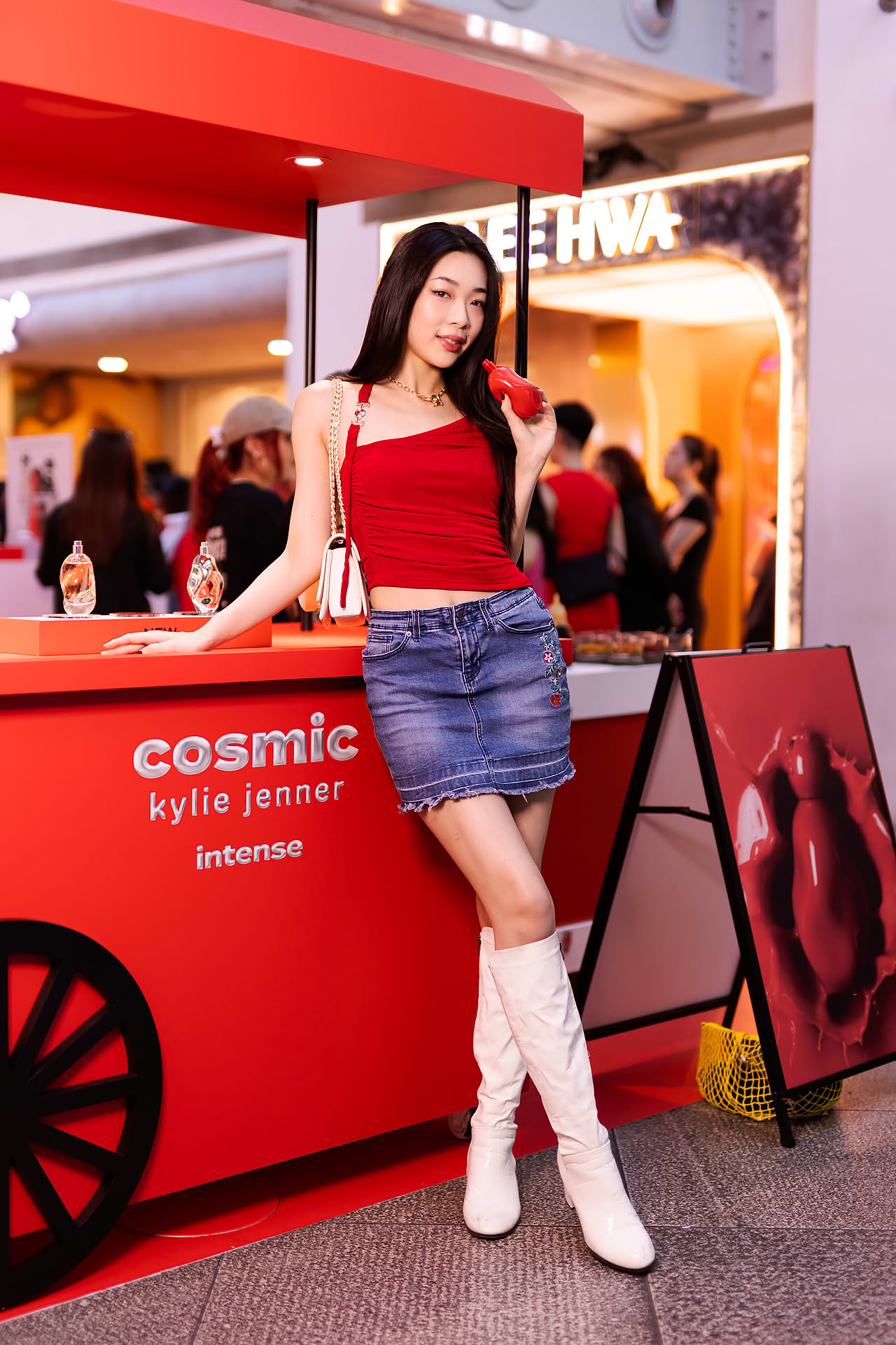 Model posing at Kylie Cosmetics pop-up stall in Bugis Junction
