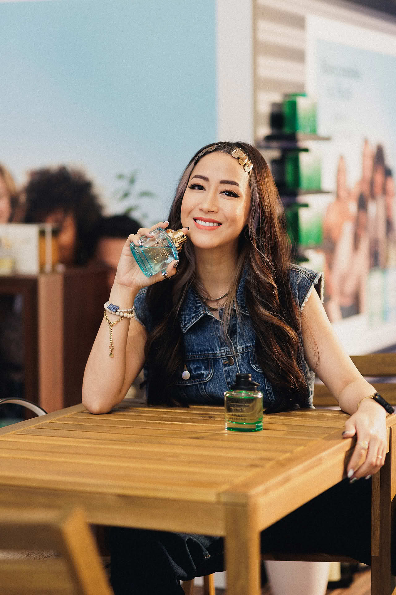 Influencer posing with Abercrombie and Fitch perfume