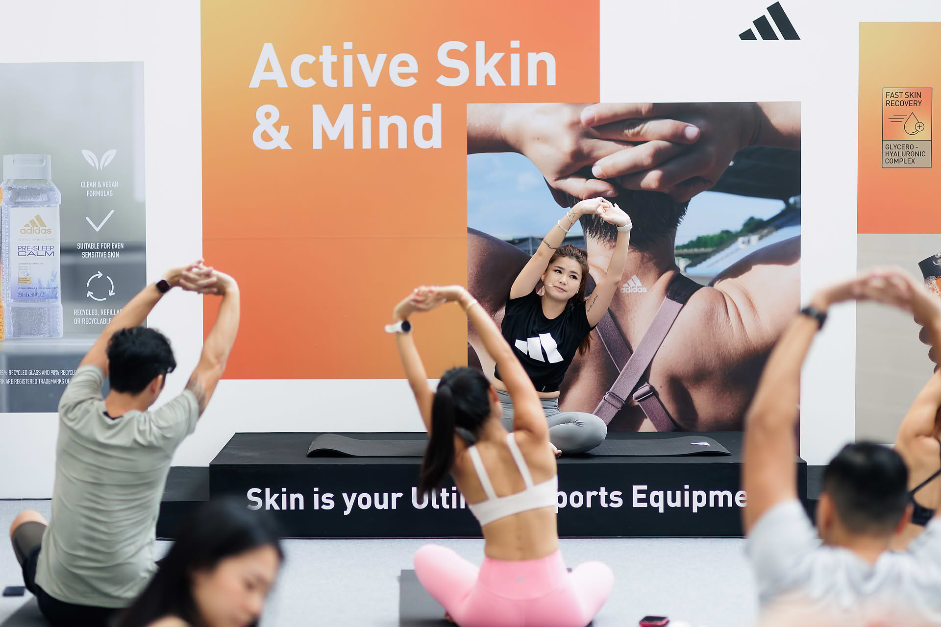 Influencers taking yoga lesson at Adidas Pop-up stall