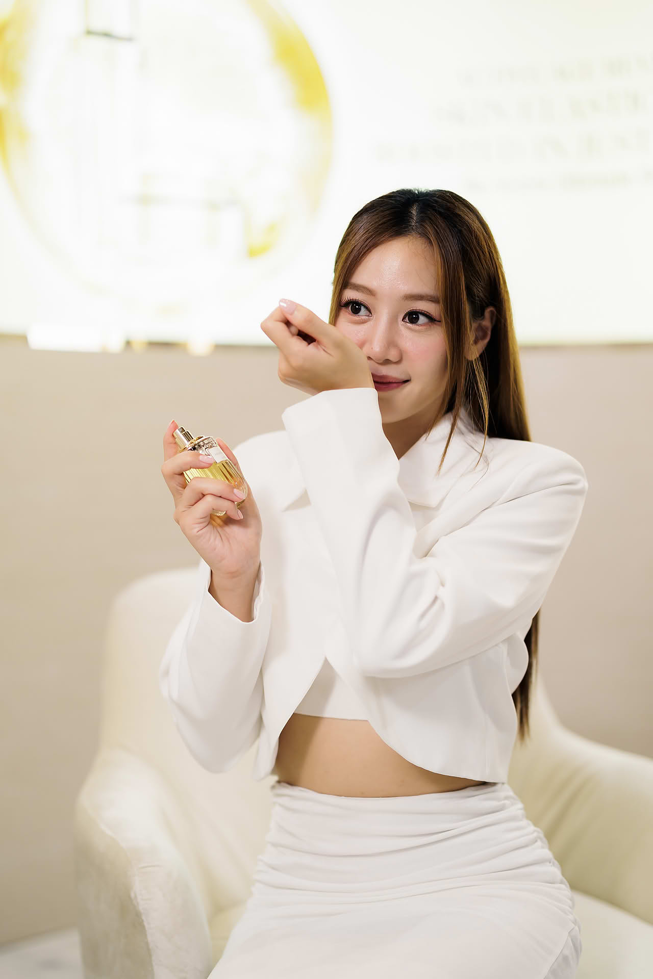 Tasha Low using product at Estee Lauder Yoona PR event in Paragon