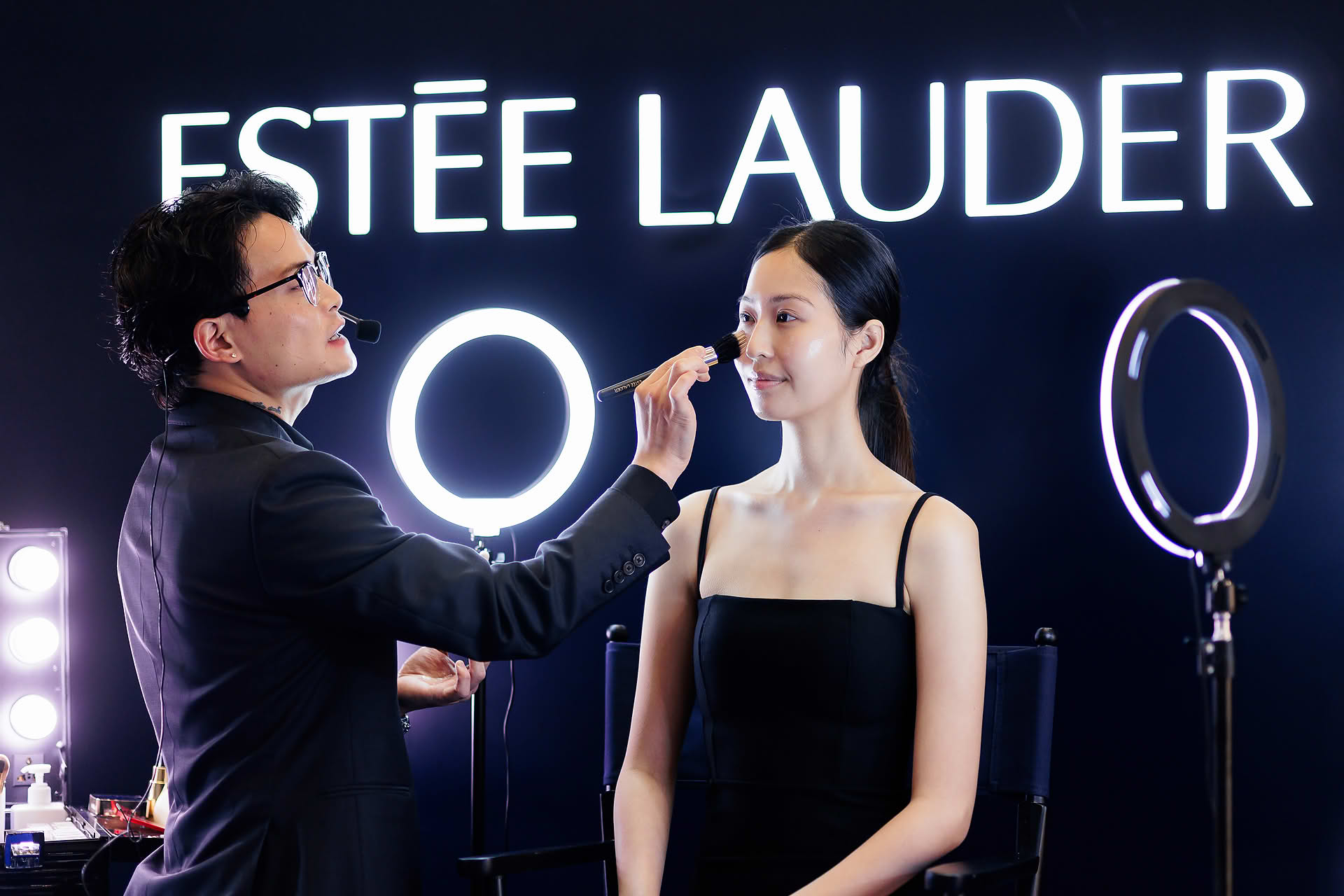 Makeup artist teaching at Estee Lauder PR event