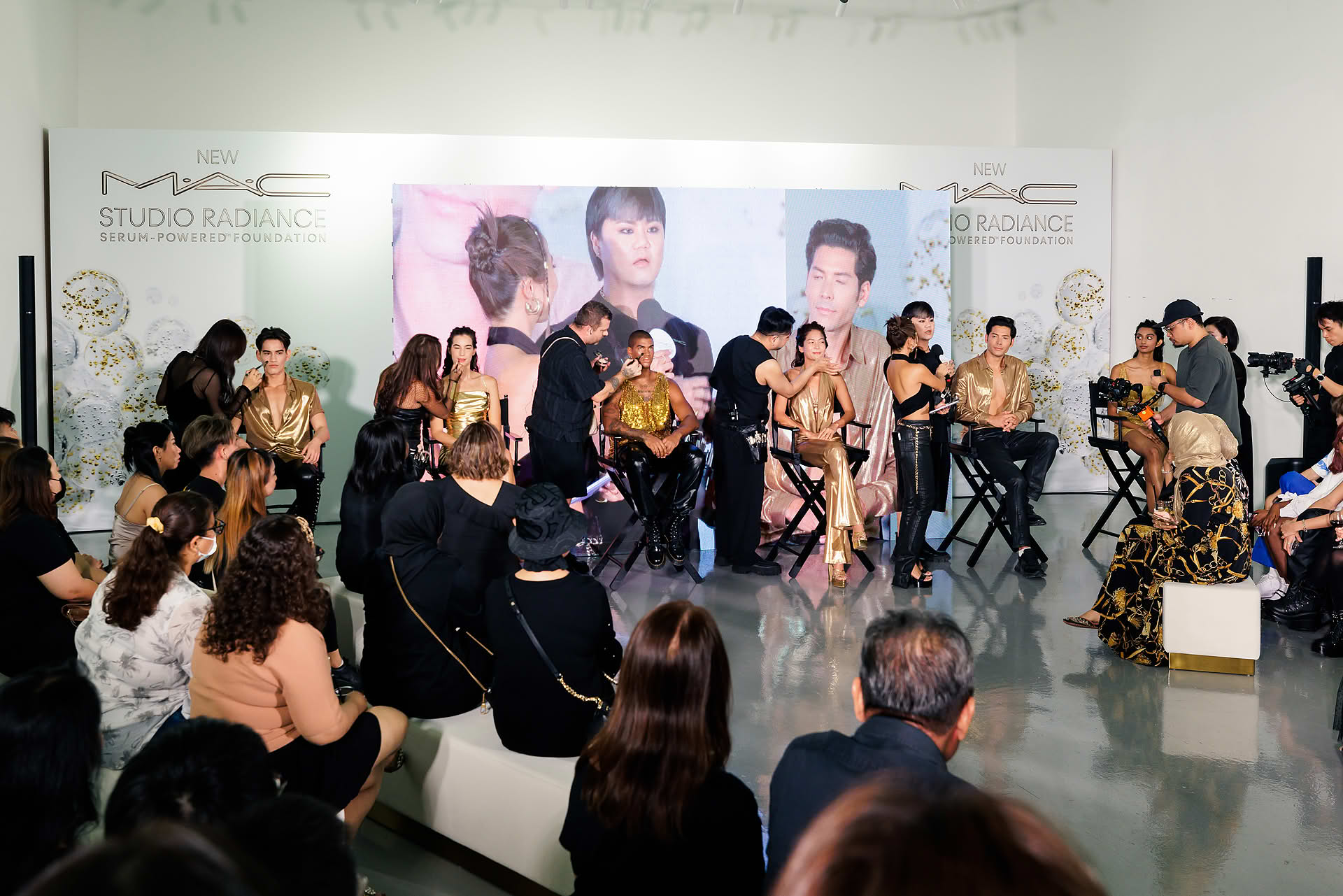 Makeup artists demonstrating at MAC Cosmestics PR event
