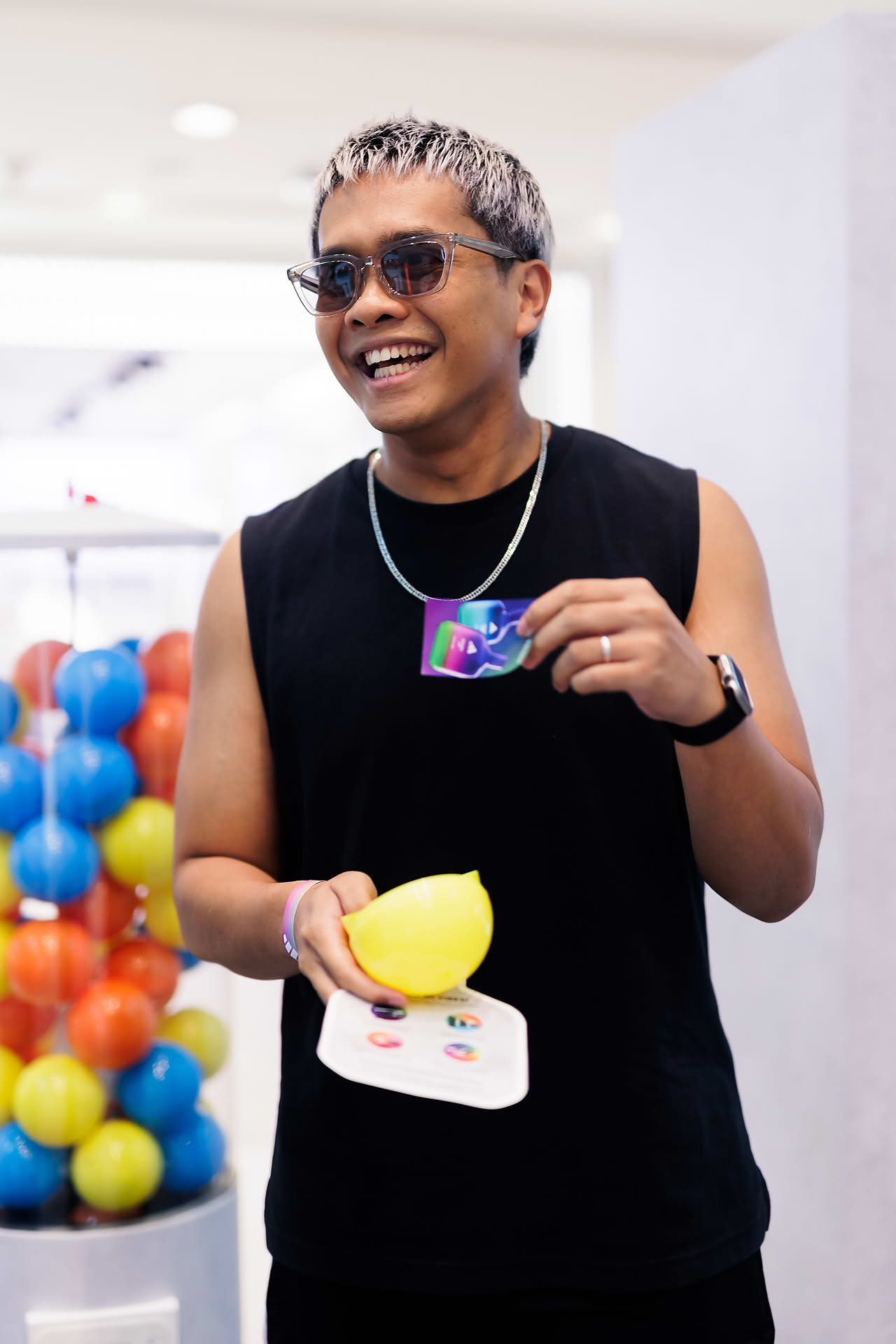 KOL winning a gashapon prize at Addidas Vibe pop-up stall in Plaza Singapura