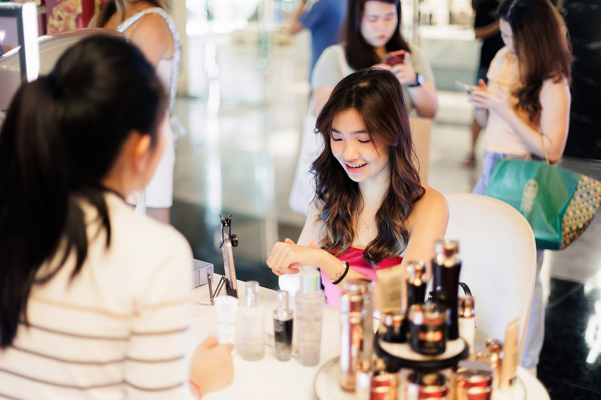 Guste trying products at Lancome Chinese New Year lion dance celebration