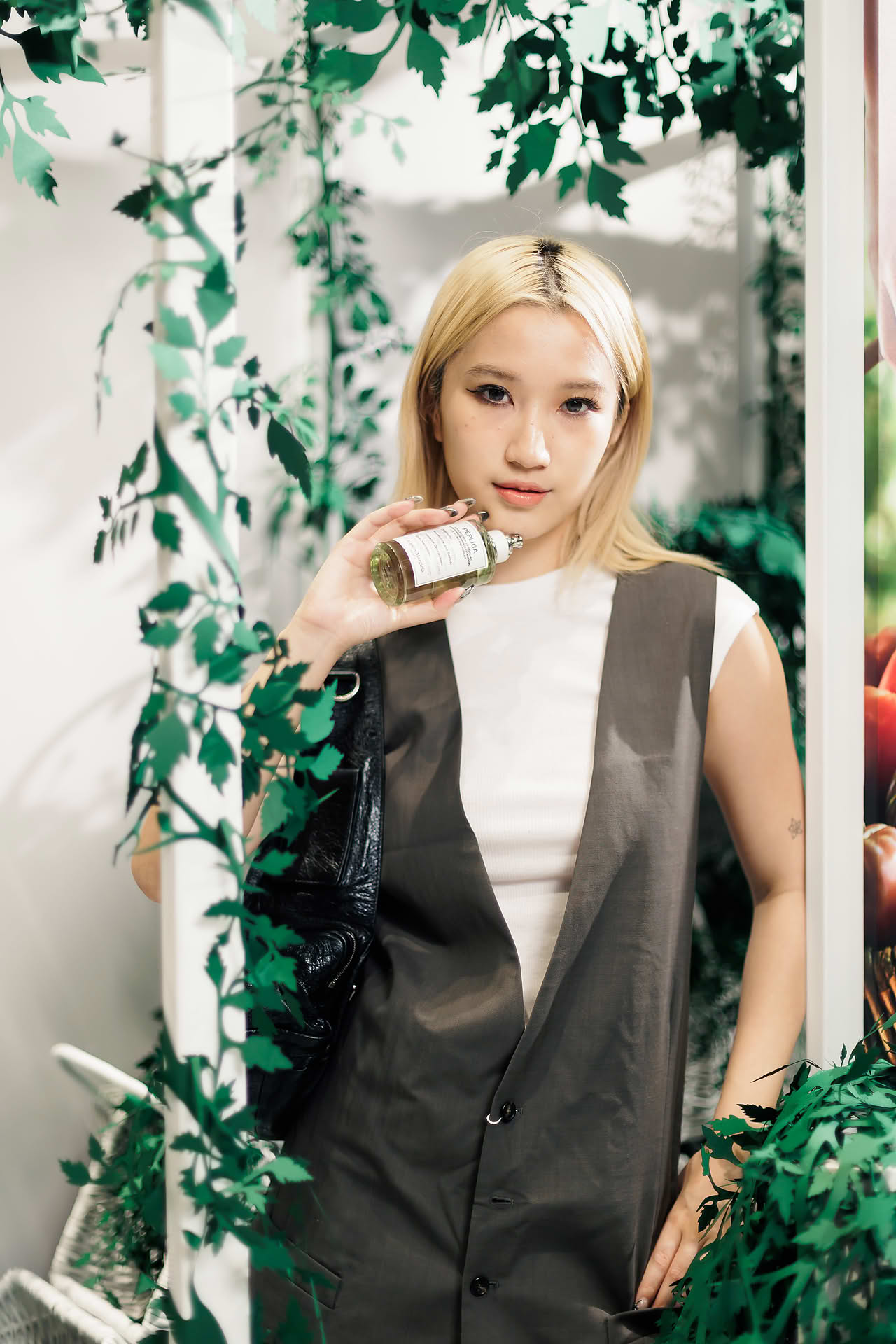 Influencer posing with Maison Margiela Replica for PR event at Ngee Ann City