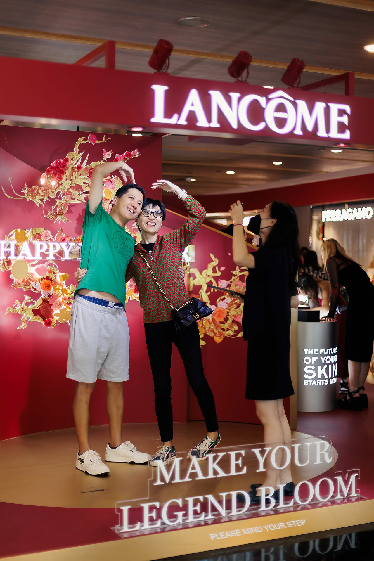 Visitors taking photo at Lancome Chinese New Year lion dance celebration