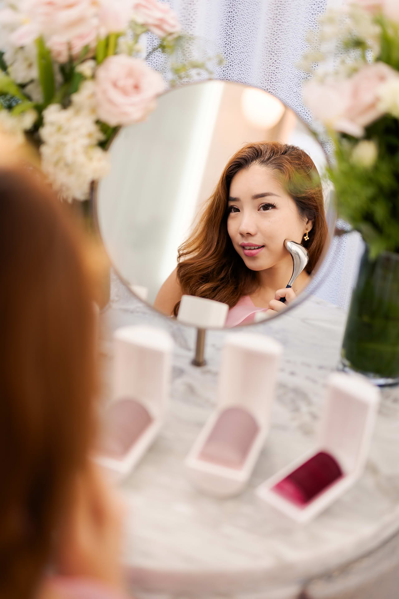 KOL doing facial massage at Noble Panacea PR event