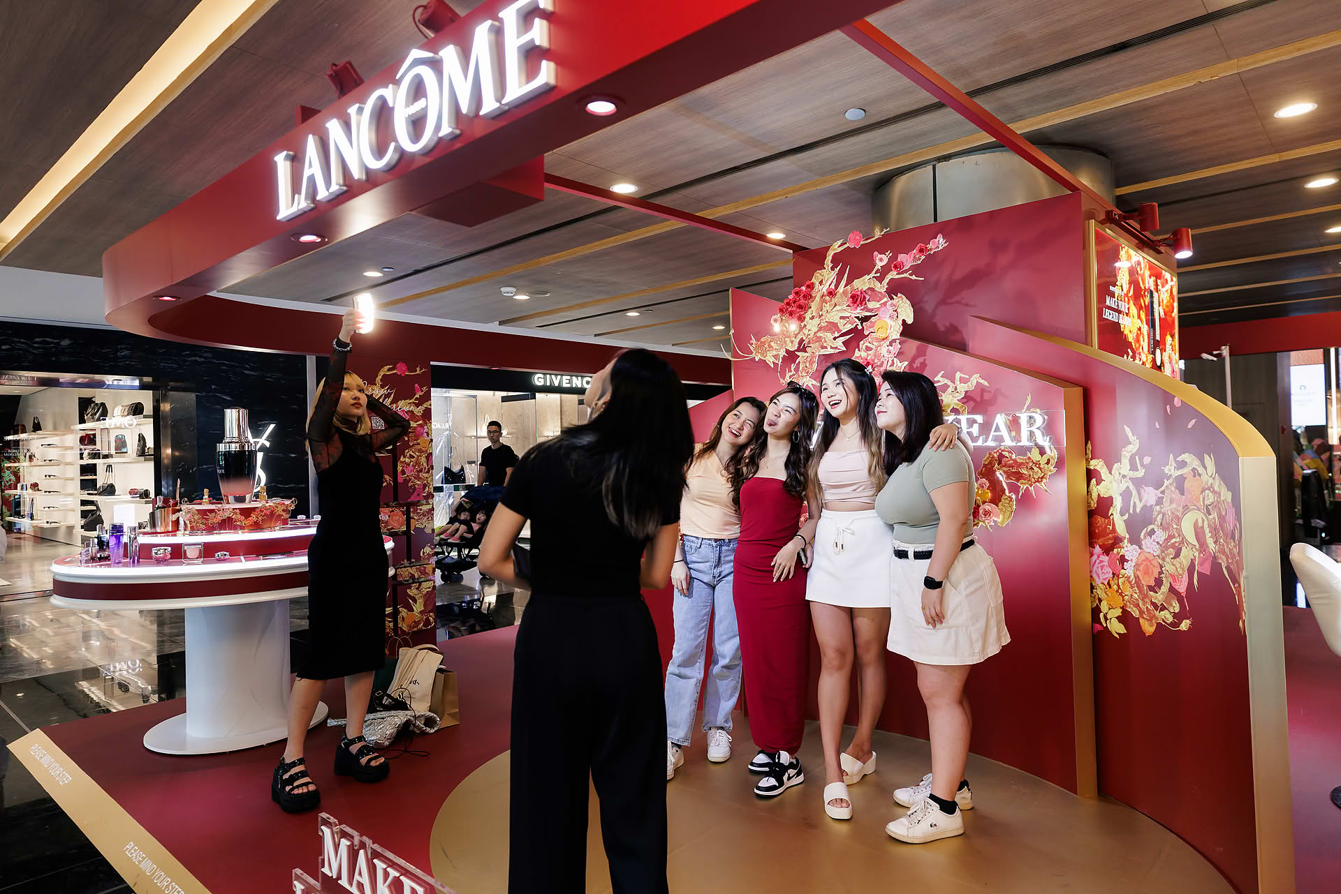 Guste taking photos at Lancome Chinese New Year lion dance celebration