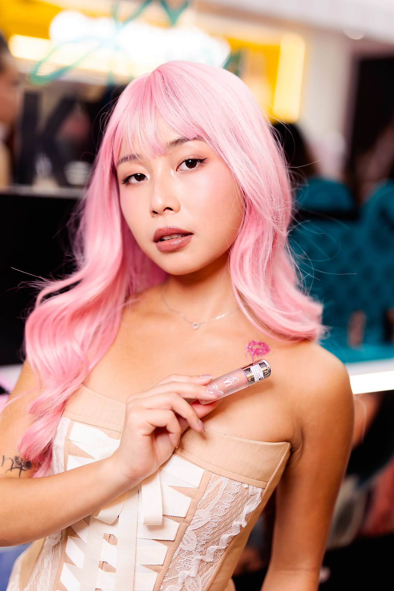 Influecer posing at Kylie Cosmetics pop-up stall in Bugis Junction