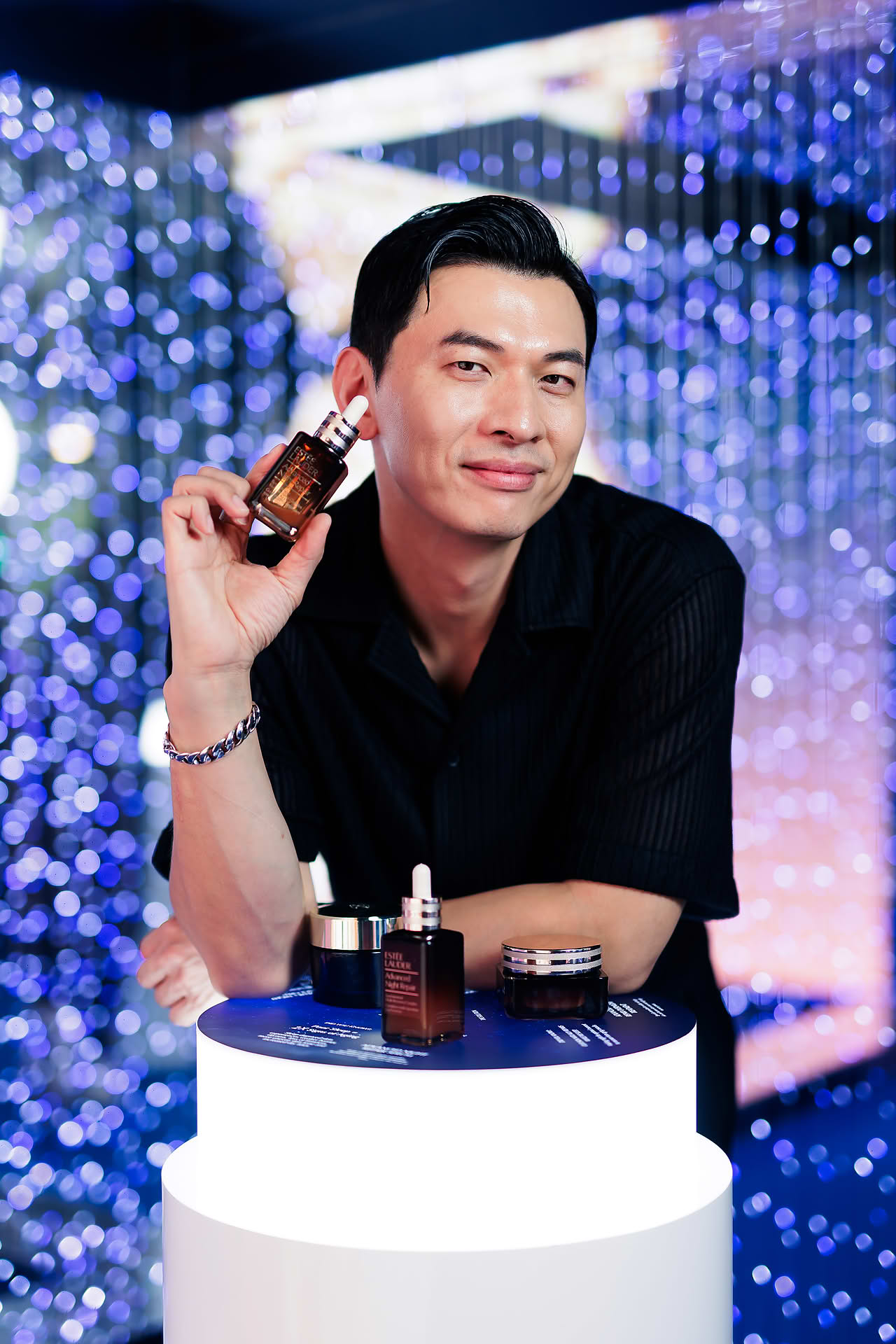 Korean makeup artist posing with a product at Estee Lauder PR event