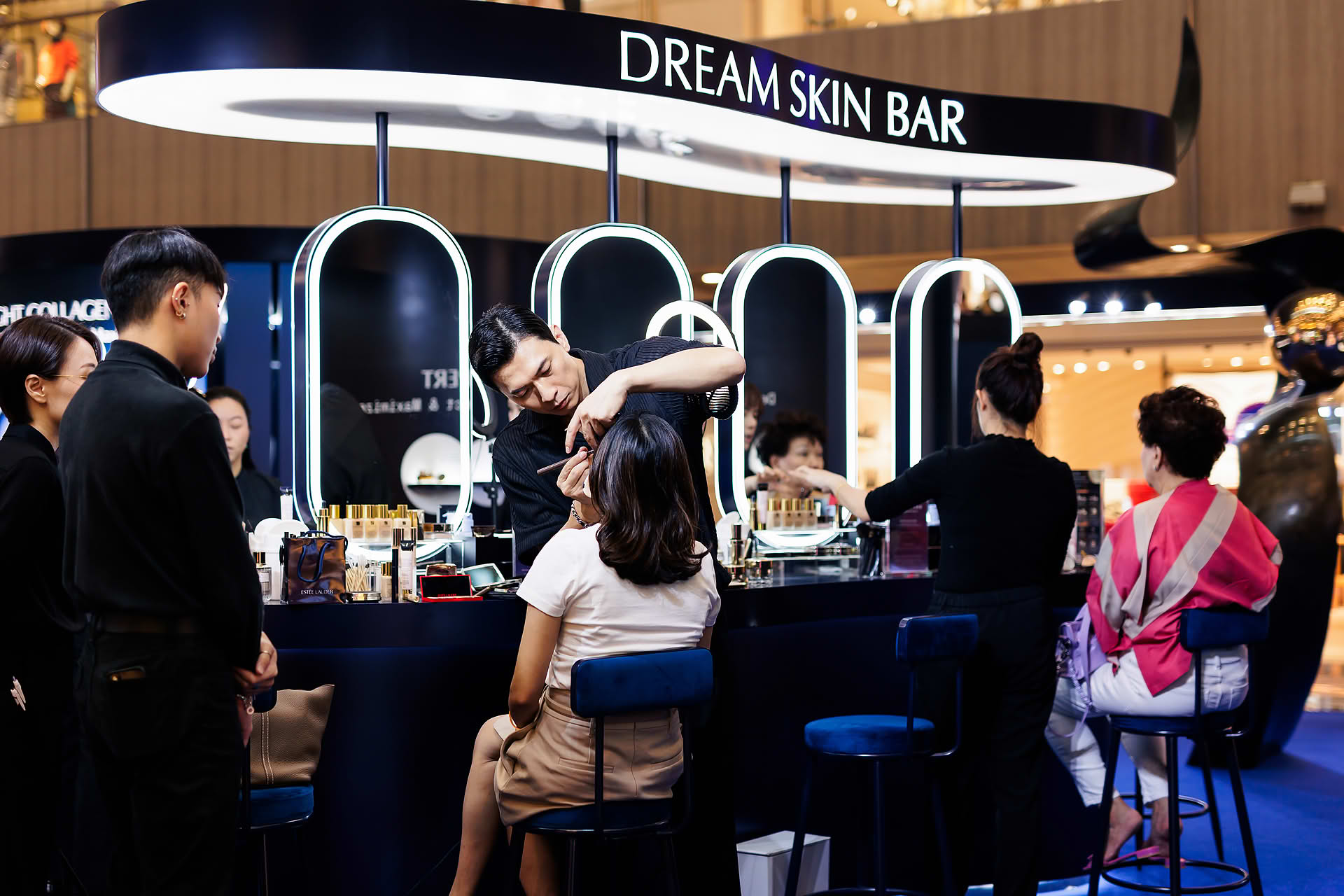 Guest getting makeup done by Korean makeup artist at Estee Lauder PR event