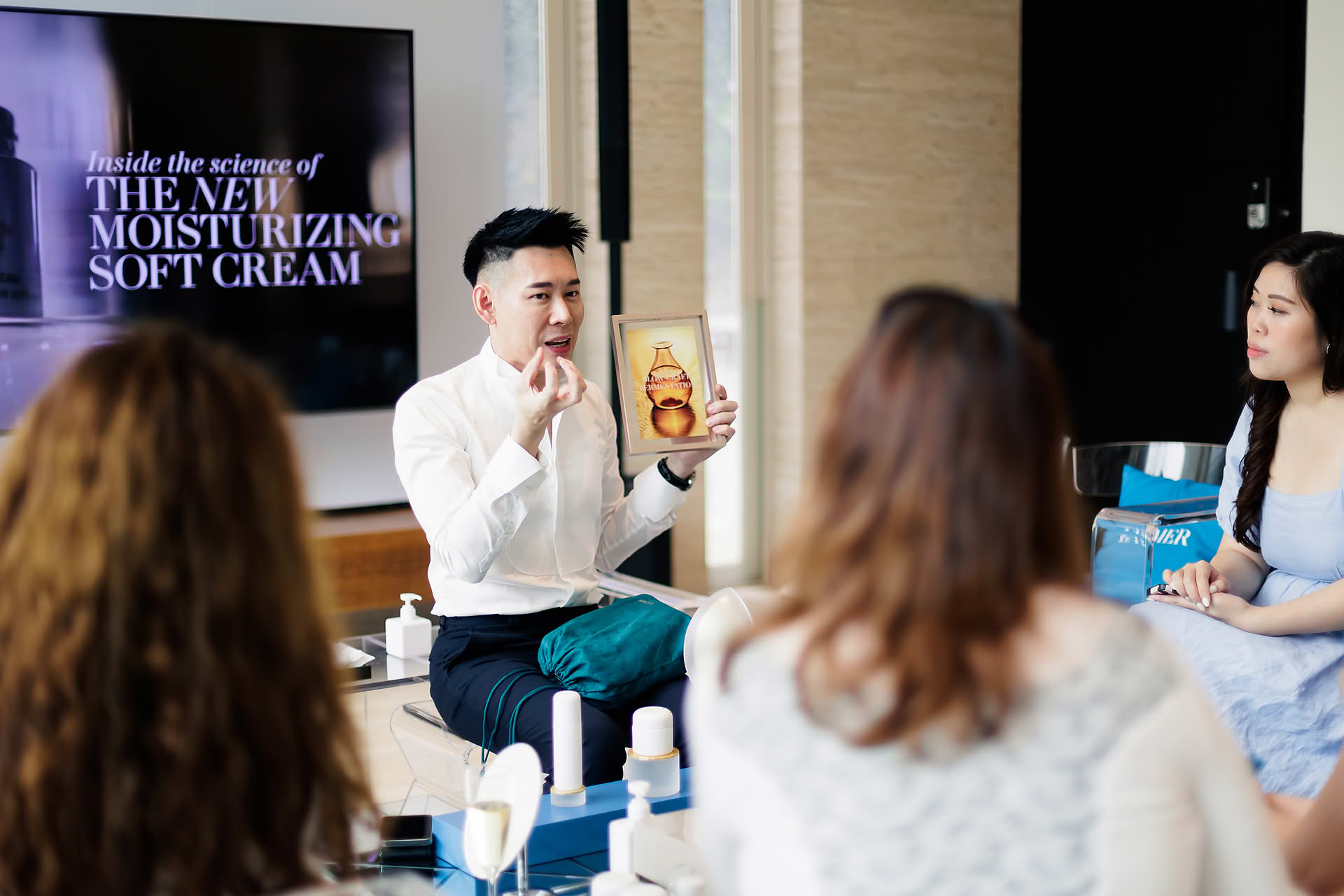 Staff giving presentation at La Mer PR event in Sentosa