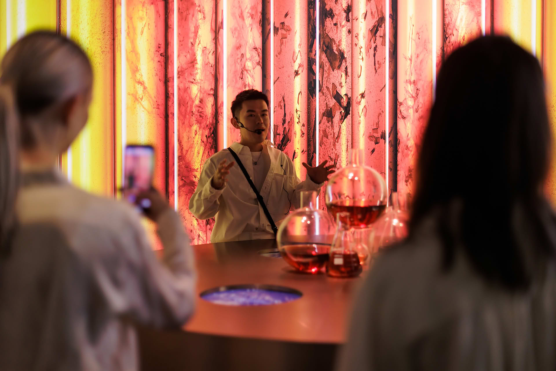 Host presenting at immersive display zone at La Mer WCD PR event