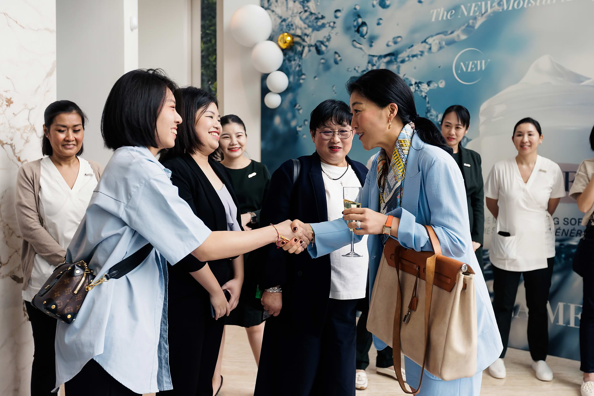 Guests welcomed with handshake at La Mer PR event in Sentosa