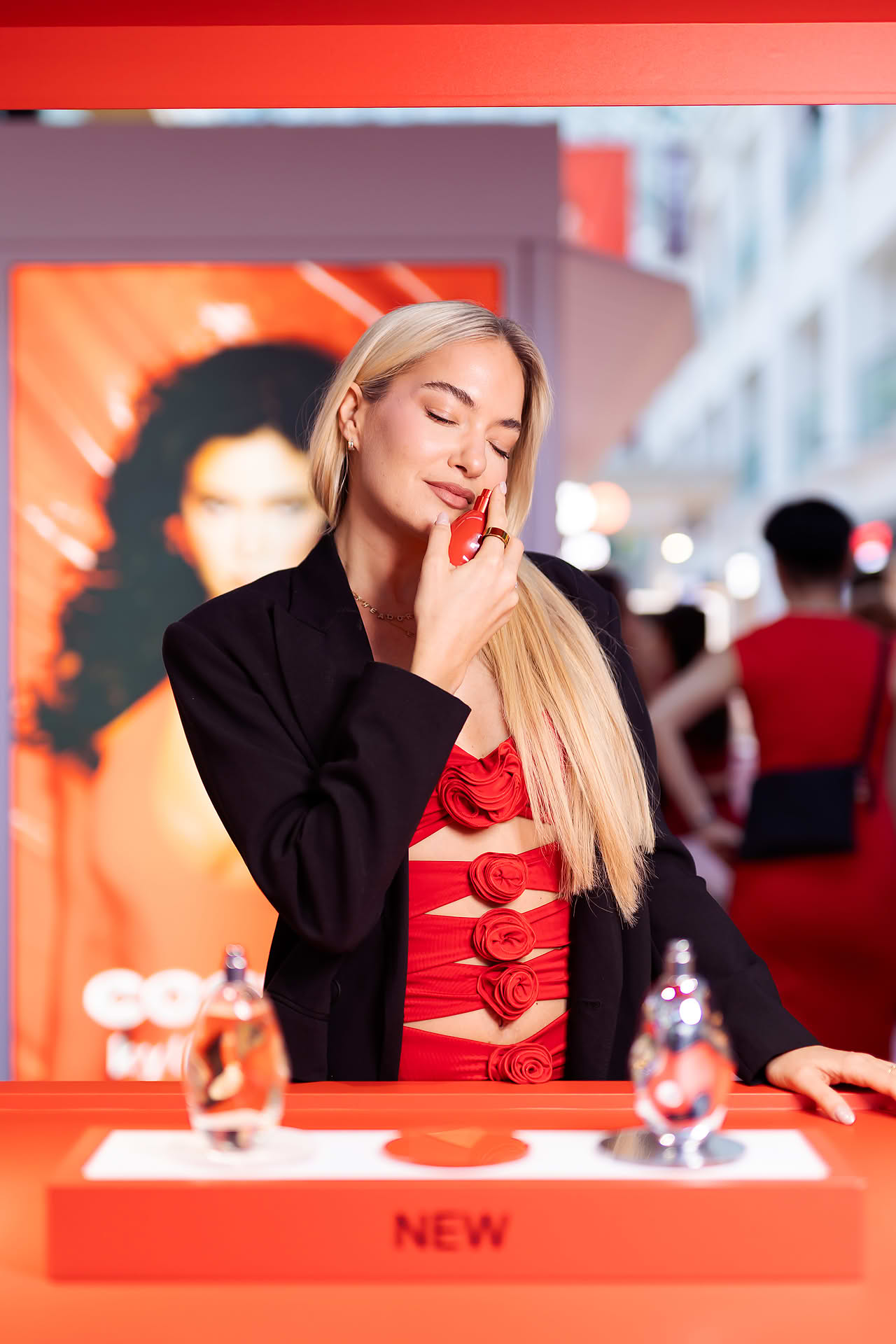 Influencers posing with product at Kylie Cosmetics pop-up stall in Bugis Junction