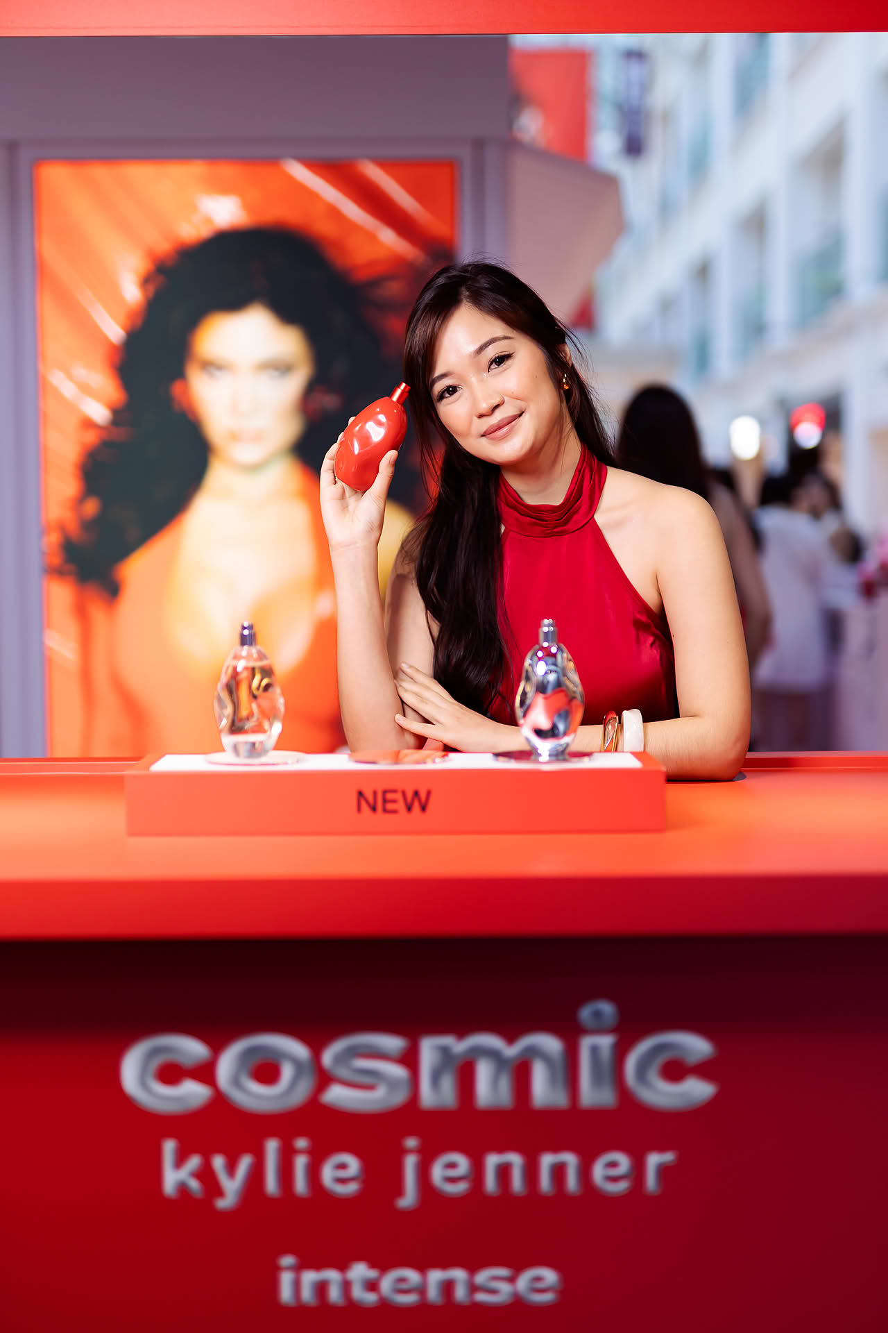 KOL posing with product at Kylie Cosmetics pop-up stall in Bugis Junction