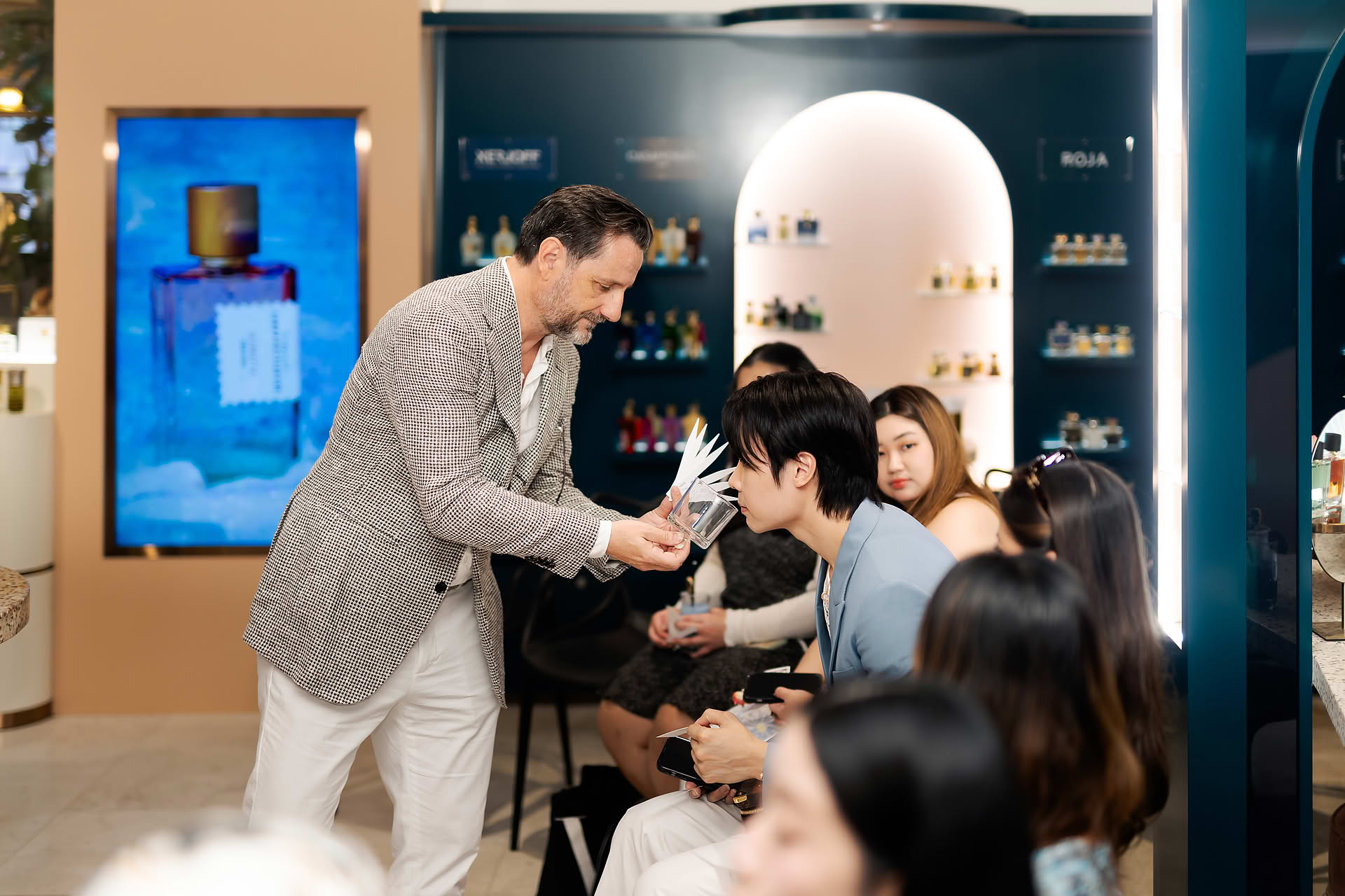 Guest sniffing perfume at Goldfield & Banks PR event
