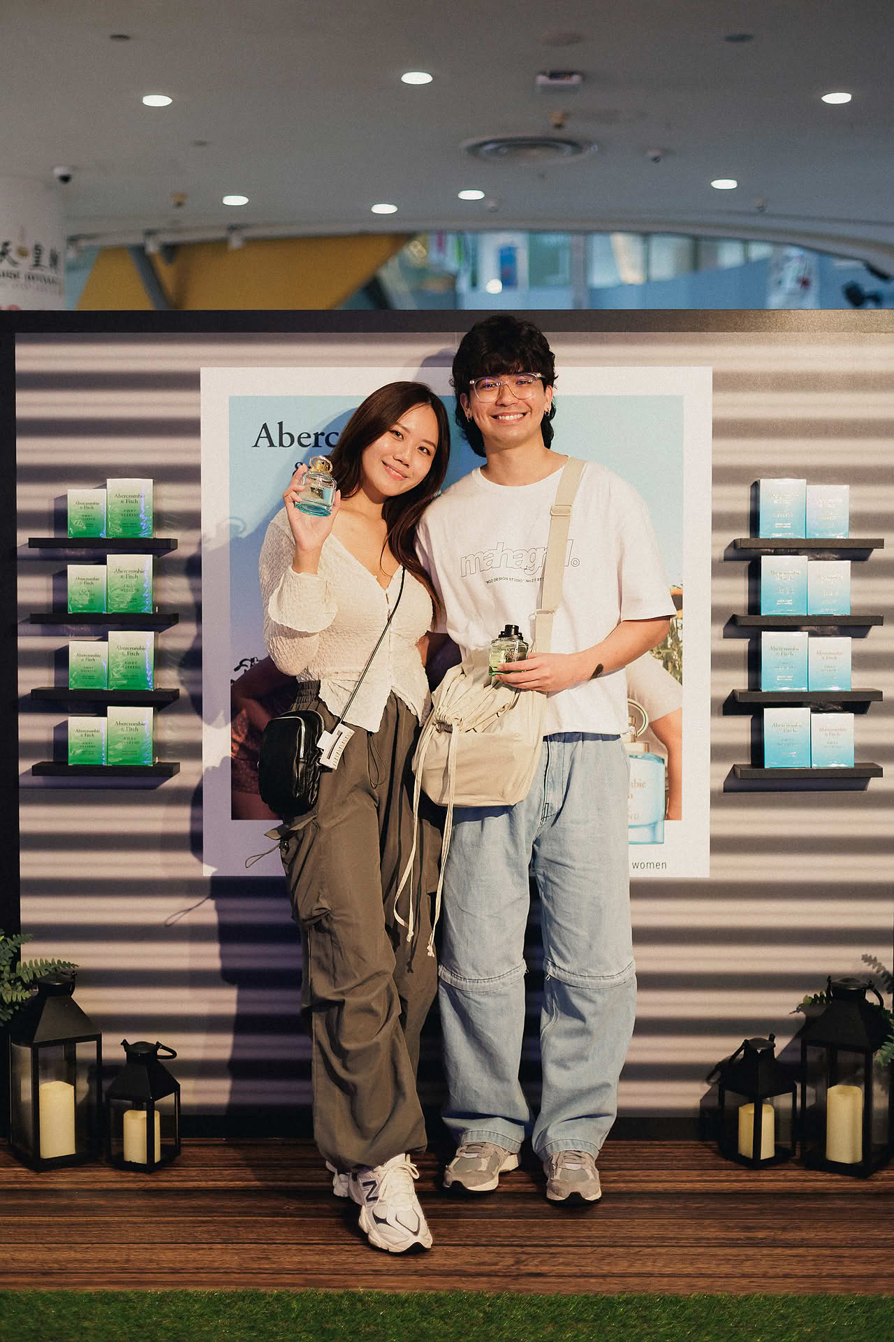 Influencer couple posing with Abercrombie and Fitch perfume