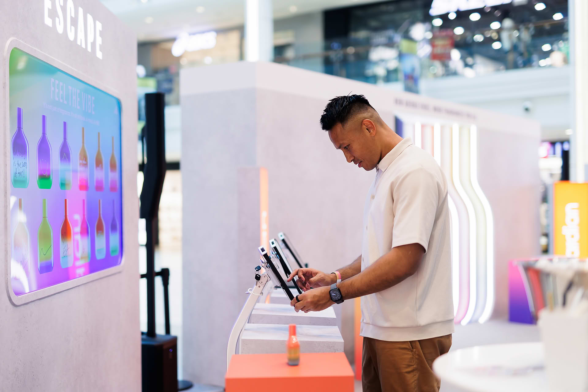 KOL at interactive kiosk at Addidas Vibe pop-up stall in Plaza Singapura