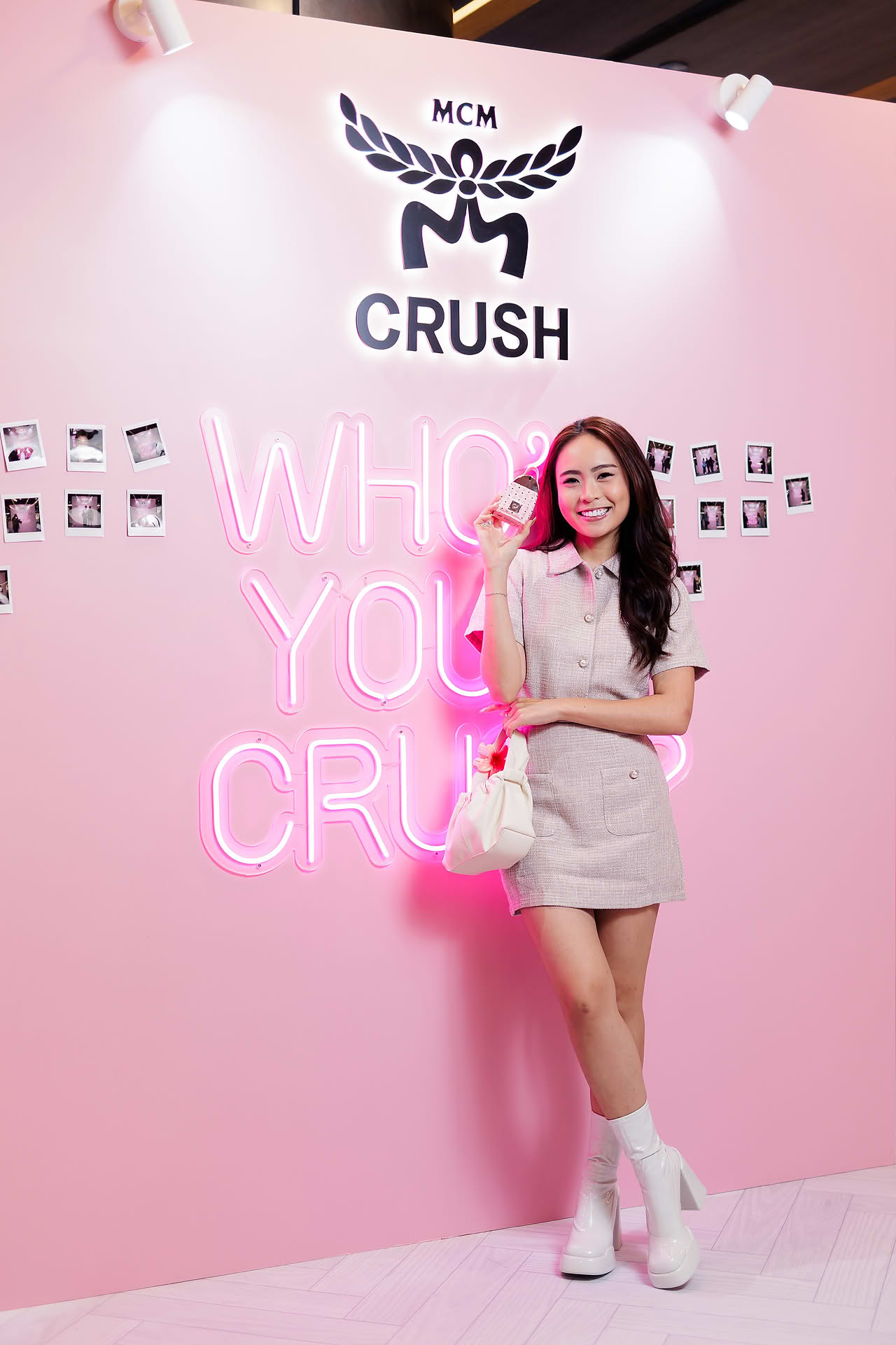 Influencer posing with MCM Crush perfume at pop-up stall in Ngee Ann City