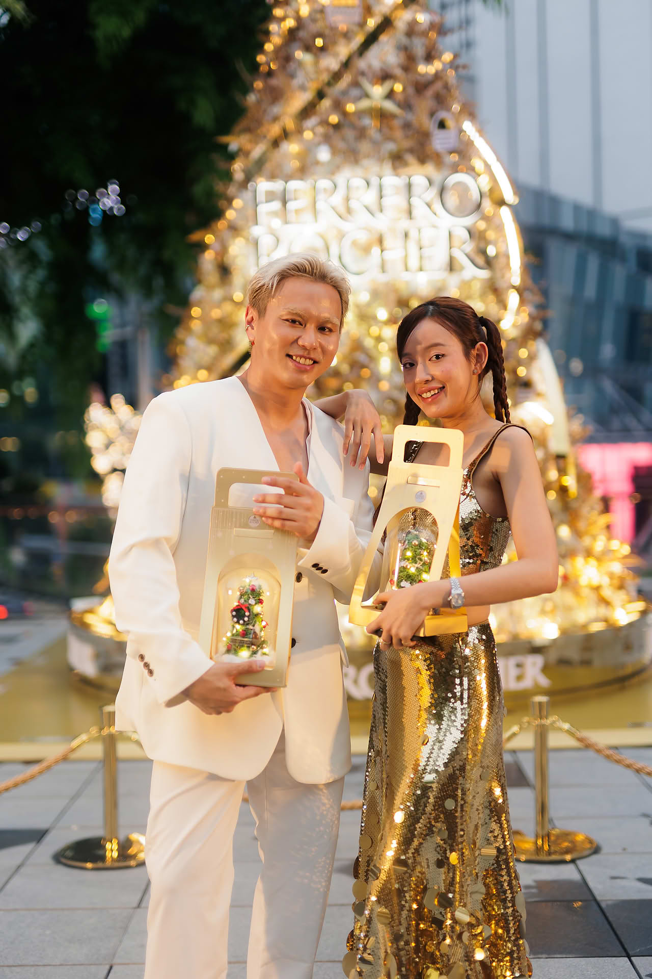 Influencer posing at Ferrero Rocher Christmas tree
