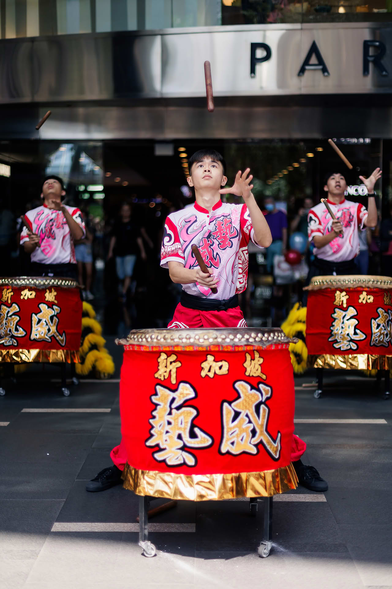 Lion dance drummer at Lancome Chinese New Year lion dance celebration