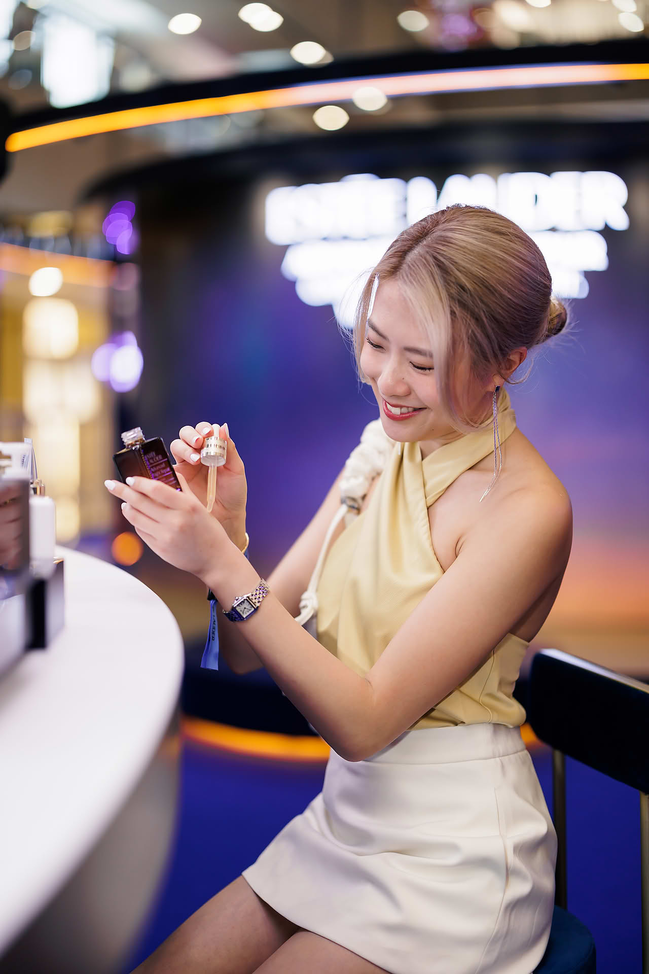 Influencer trying Estee Lauder product during Yoona PR event in Paragon