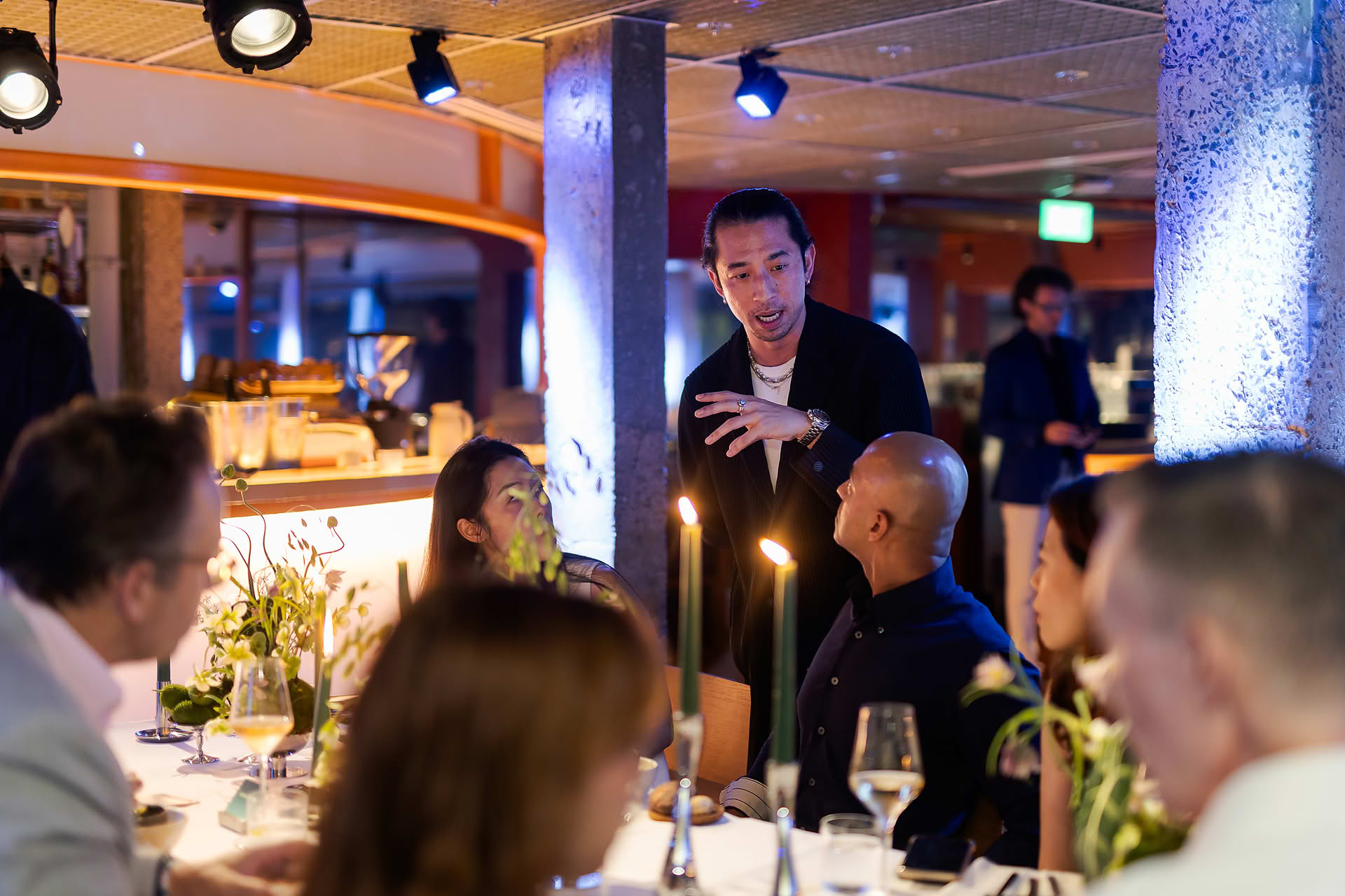 Host interacting with guest at Amex 1850