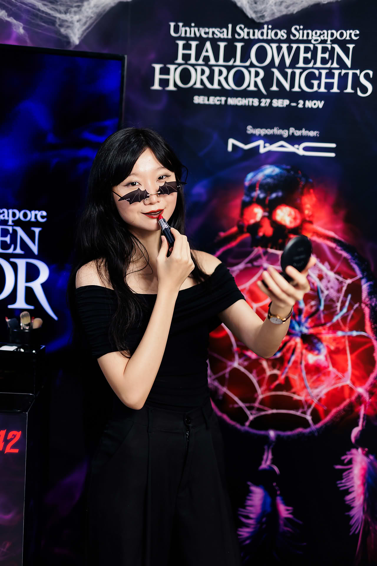 Influencer posing at MAC Cosmetics Halloween event