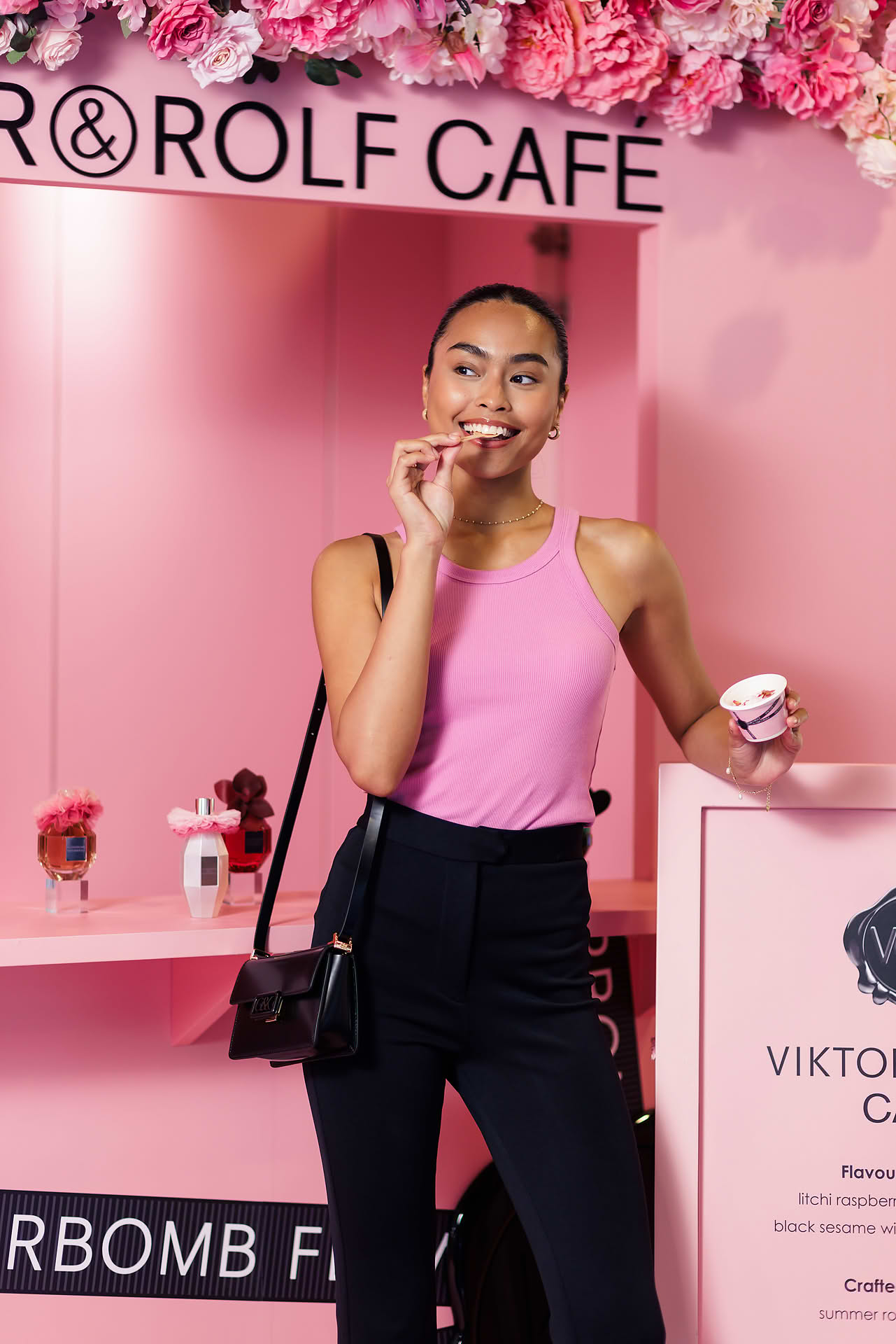 Model eating food served at Vicktor Rolf Cafe pop-up stall in Paragon