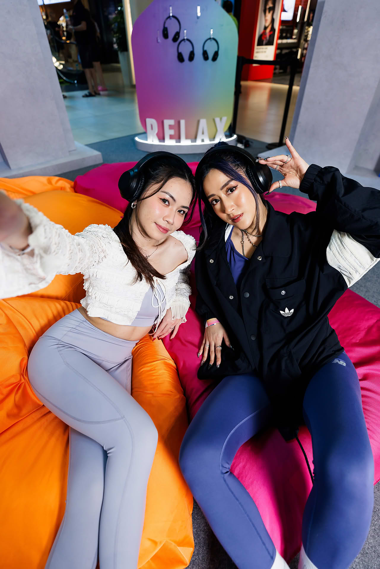 Influencer resting at Relax corner at Addidas Vibe pop-up stall in Plaza Singapura